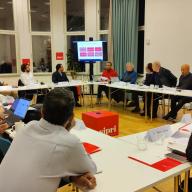 Workshop participants discuss research findings