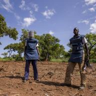 Two members of the United Nations Mine Action Service in a mine clearance site in Aru Junction, South Sudan in 2015