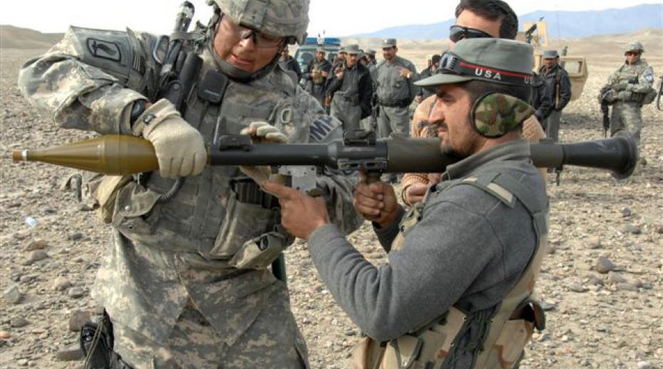 A US Army soldier coaches an Afghan National Police officer. Photo: The U.S. Army/Flickr