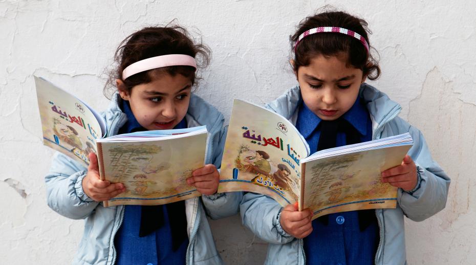 Young girls reading in Jordan. Photo: Tanya Habjouqa