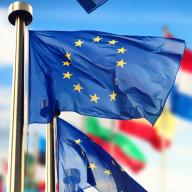 EU flags waving in front of European Parliament